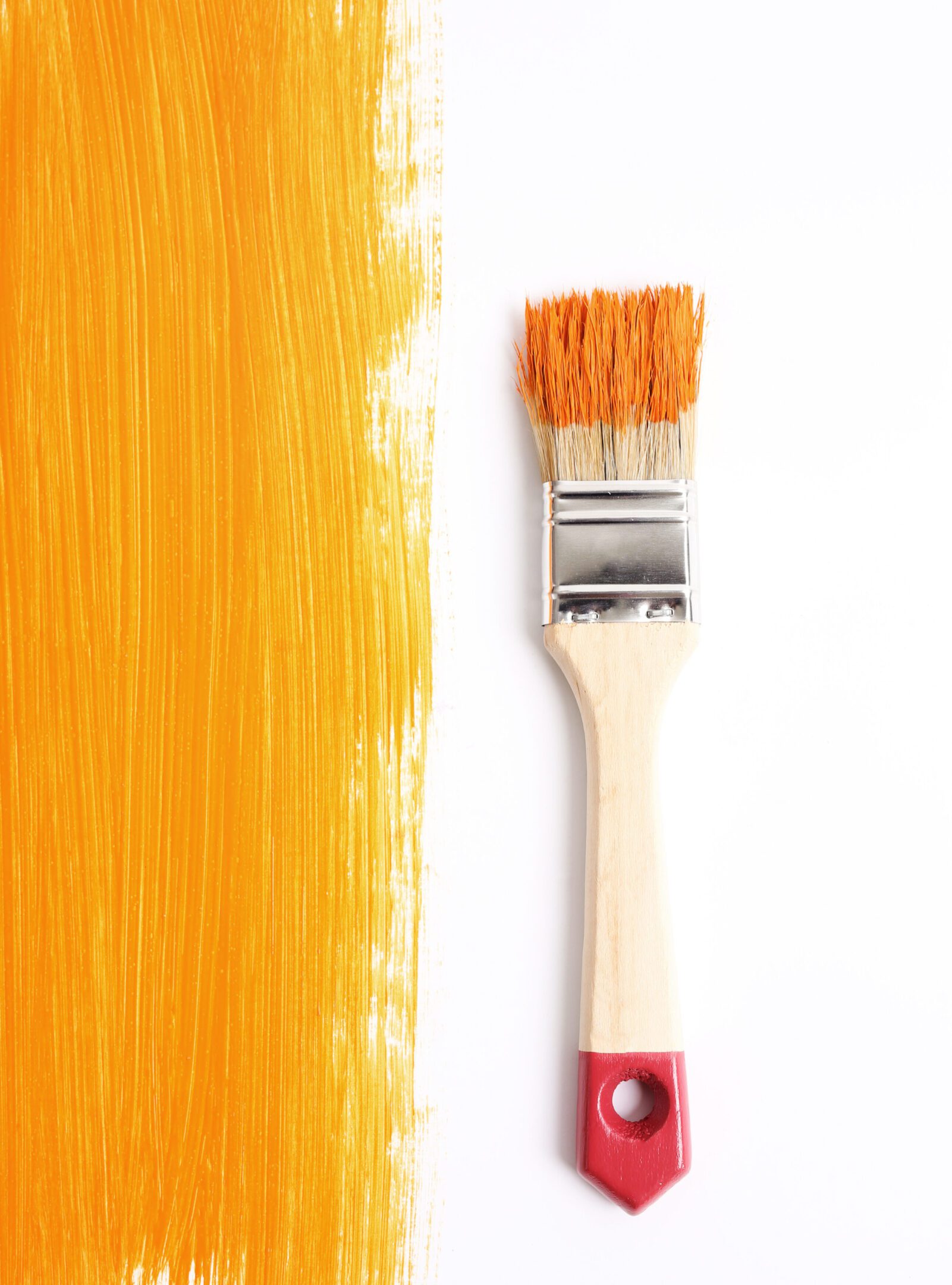 Paint Renovation. Brush with orange paint